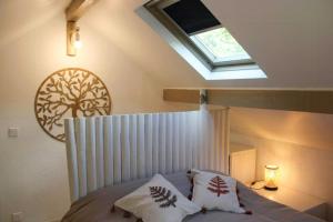 a bedroom with a canopy bed with a skylight at 17Th Century Renovated Barn In Valdeblore in Valdeblore