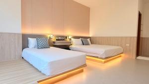 Postel nebo postele na pokoji v ubytování 東港民宿 - 如你所院 Tourist Vacation B&B