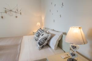 Posteľ alebo postele v izbe v ubytovaní Azzurro Bianco Suites