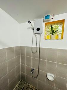 a shower in a bathroom with a shower at Villa Hortillosa - Your Home Away from Home in Baras