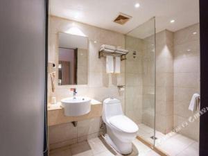 a bathroom with a toilet and a sink and a shower at City Comfort Inn Changsha Wanjiali Mawangdui Metro Station in Changsha +144 photos