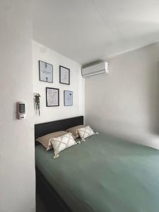 Postel nebo postele na pokoji v ubytování Le Frangipanier + 8 fotografií