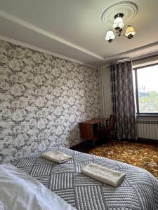 Postel nebo postele na pokoji v ubytování Guest House Alim