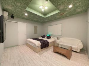 Letto o letti in una camera di ホテルアテネ 市原鶴舞インター店