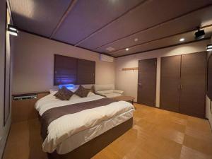 Letto o letti in una camera di ホテルアテネ 市原鶴舞インター店
