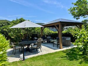 Κήπος έξω από το 一棟貸別荘Seaside Villa! 最大12名 弓ヶ浜海水浴場徒歩5分!ペット可