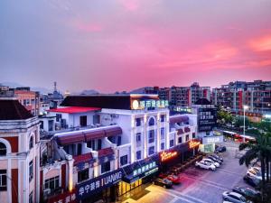 a view of a city at night at City Comfort Inn Zhongshan Hot Spring Resort Sanxiang Shunchang Plaza in Zhongshan