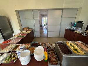 a buffet line with many different types of food at Tasarz 2 in Rewal