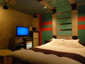 Letto o letti in una camera di ホテルアテネ 市原鶴舞インター店