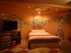 Letto o letti in una camera di ホテルアテネ 市原鶴舞インター店