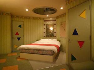Letto o letti in una camera di ホテルアテネ 市原鶴舞インター店