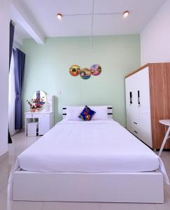 Ένα ή περισσότερα κρεβάτια σε δωμάτιο στο Homestay Gia Đình +10 φωτογραφίες
