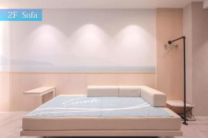 Postel nebo postele na pokoji v ubytování SAUNA&HOTEL Suuh スゥ