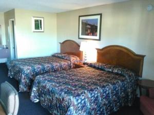 Postel nebo postele na pokoji v ubytování Cedars Inn Lewiston