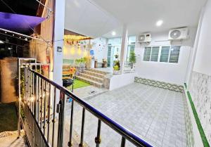 a staircase in a house with a stair case at Baan Punrak Homestay in Ban Nong Chaeng