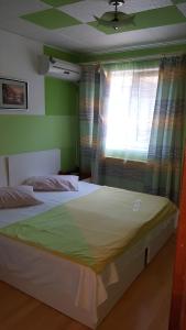 Postel nebo postele na pokoji v ubytování Vila Happy
