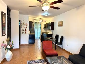a living room with a couch and a ceiling fan at Condo Morpho with 2bed 2 baths in Coco