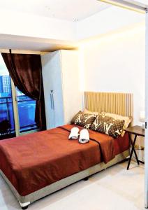 Ένα ή περισσότερα κρεβάτια σε δωμάτιο στο Azure Staycation 1 bedroom can fit 2 to 4Pax +19 φωτογραφίες