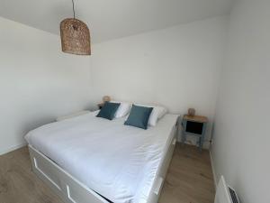 Ένα ή περισσότερα κρεβάτια σε δωμάτιο στο Appartement Le Riva B304