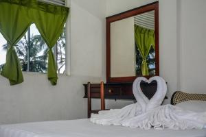 Postel nebo postele na pokoji v ubytování Mami Resort