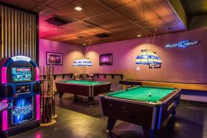 a gaming room with two pool tables and a machine at Quality Inn Duncan HWY 81 in Duncan