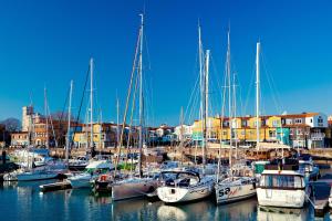 a bunch of boats are docked in a harbor at Lagrange Apart'Hotel l’Escale Marine in La Rochelle