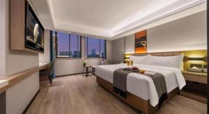 Ein Bett oder Betten in einem Zimmer der Unterkunft Nanning Prince Hotel