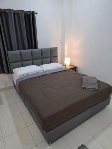 Postel nebo postele na pokoji v ubytování K2 Seaside Suites