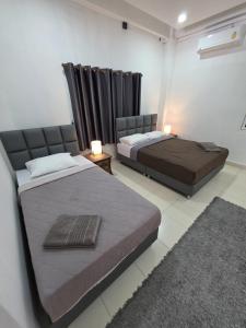 Postel nebo postele na pokoji v ubytování K2 Seaside Suites