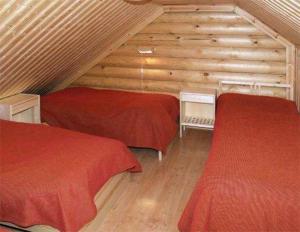 En eller flere senge i et værelse på Serena Villas