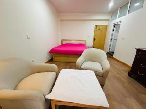 Postel nebo postele na pokoji v ubytování Sri Aurobindo Yoga Mandir
