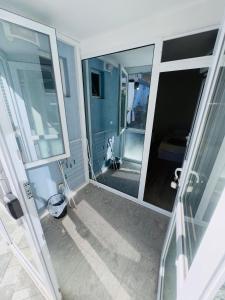 a view of a bathroom with a large mirror at Villa SUN in Kiten