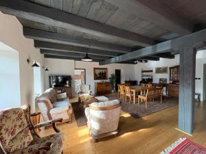 a living room with furniture and a dining room at Feltlův mlýn v Borovnici in Borovnice
