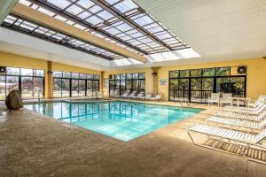a large indoor pool with chairs at Quality Inn Perry - National Fairgrounds Area in Perry
