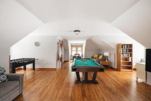 a living room with a pool table in it at Spacious Victorian 5 BDR Broomhead Farmhouse - 5721 in Rapid City