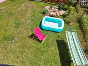 an overhead view of two lawn chairs and a blue and white tray at Chata Alaska in Jáchymov