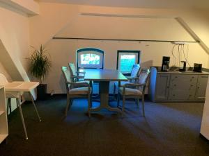 a dining room with a table and chairs at Alte Wassermühle in Lenzen