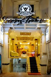 a store front of a store with stairs in a building at Vuong Tai Hotel in Ho Chi Minh City