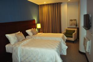 Voodi või voodid majutusasutuse Hotel Maiya toas
