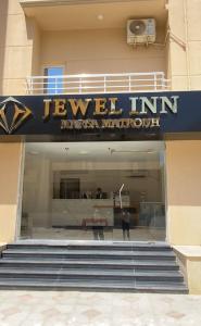 a store front with a sign for a jewelry store at Jewel Inn Matrouh in Marsa Matruh