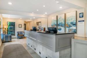 an office lobby with a reception counter with a desk at Best Western River Terrace in Cheboygan +95 photos