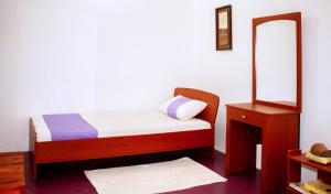 Postel nebo postele na pokoji v ubytování D'Villa Guest House