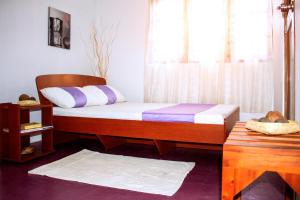 Postel nebo postele na pokoji v ubytování D'Villa Guest House