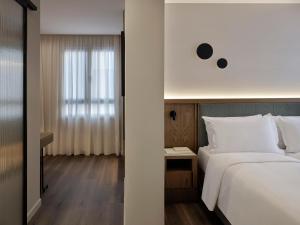 Postel nebo postele na pokoji v ubytování Electra Rhythm Athens