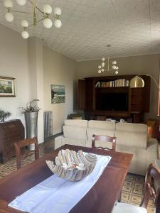 a living room with a couch and a table at Garden Villa by the sea, Mesco 60 in Monterosso al Mare