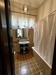 a bathroom with a tub and a sink and a bath tub at Garden Villa by the sea, Mesco 60 in Monterosso al Mare +39 photos