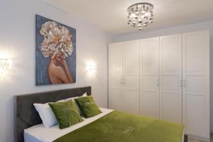 Postel nebo postele na pokoji v ubytování Smile Apartments