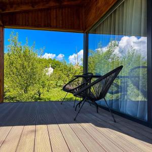 a bench sitting on the porch of a house at LakeView Villas 