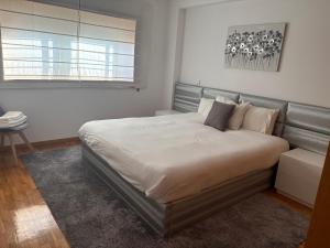 Ένα ή περισσότερα κρεβάτια σε δωμάτιο στο Apartamento moderno frente al mar