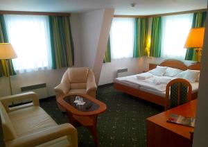 Posteľ alebo postele v izbe v ubytovaní Hotel Spindlerova Bouda